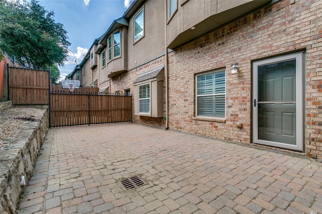 800 Rockingham Drive Irving, TX 75063 - Photo 33 of 35 a view of a brick house with a large parking space near a yard