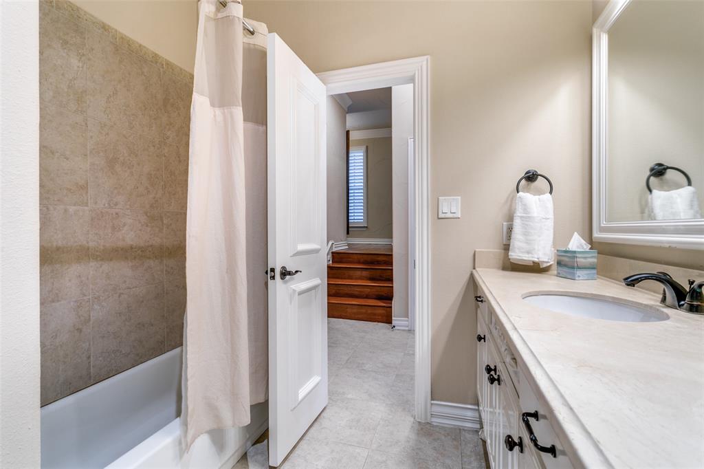 800 Rockingham Drive Irving, TX 75063 - Photo 8 of 35 a bathroom with a sink and a mirror