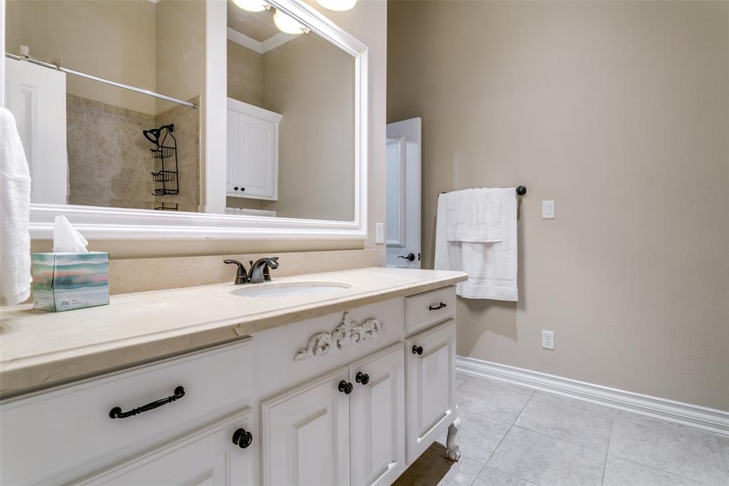 800 Rockingham Drive Irving, TX 75063 - Photo 9 of 35 a bathroom with a sink and a mirror