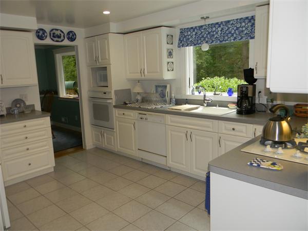 6 Richard Road Canton, MA 02021 - Photo 3 of 6 a kitchen with a sink stove and cabinets