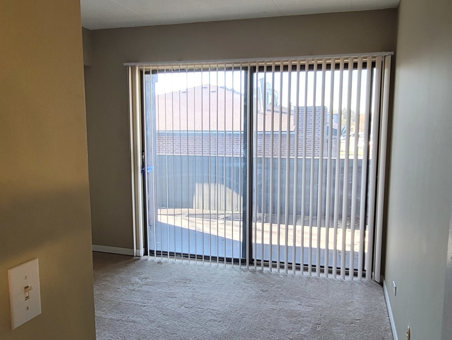 566 Timber Ridge Drive, Unit 203 Carol Stream, IL 60188 - Photo 11 of 17 a view of an empty room with a window