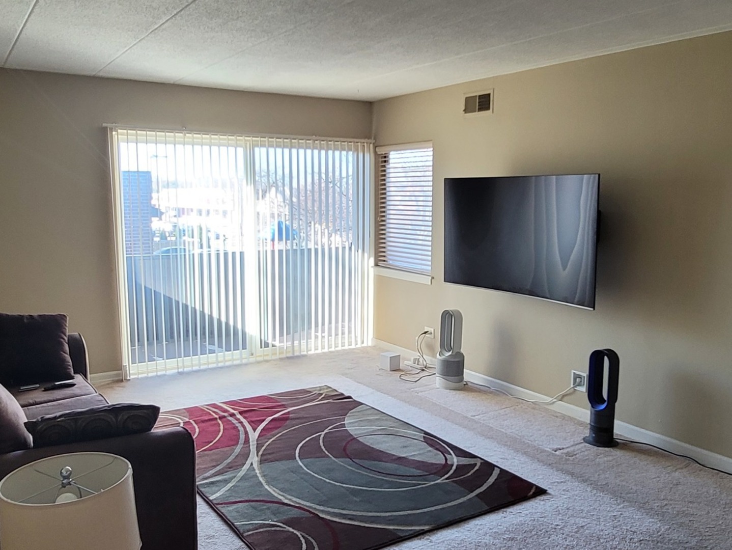 566 Timber Ridge Drive, Unit 203 Carol Stream, IL 60188 - Photo 3 of 17 a bedroom with a bed and a couch