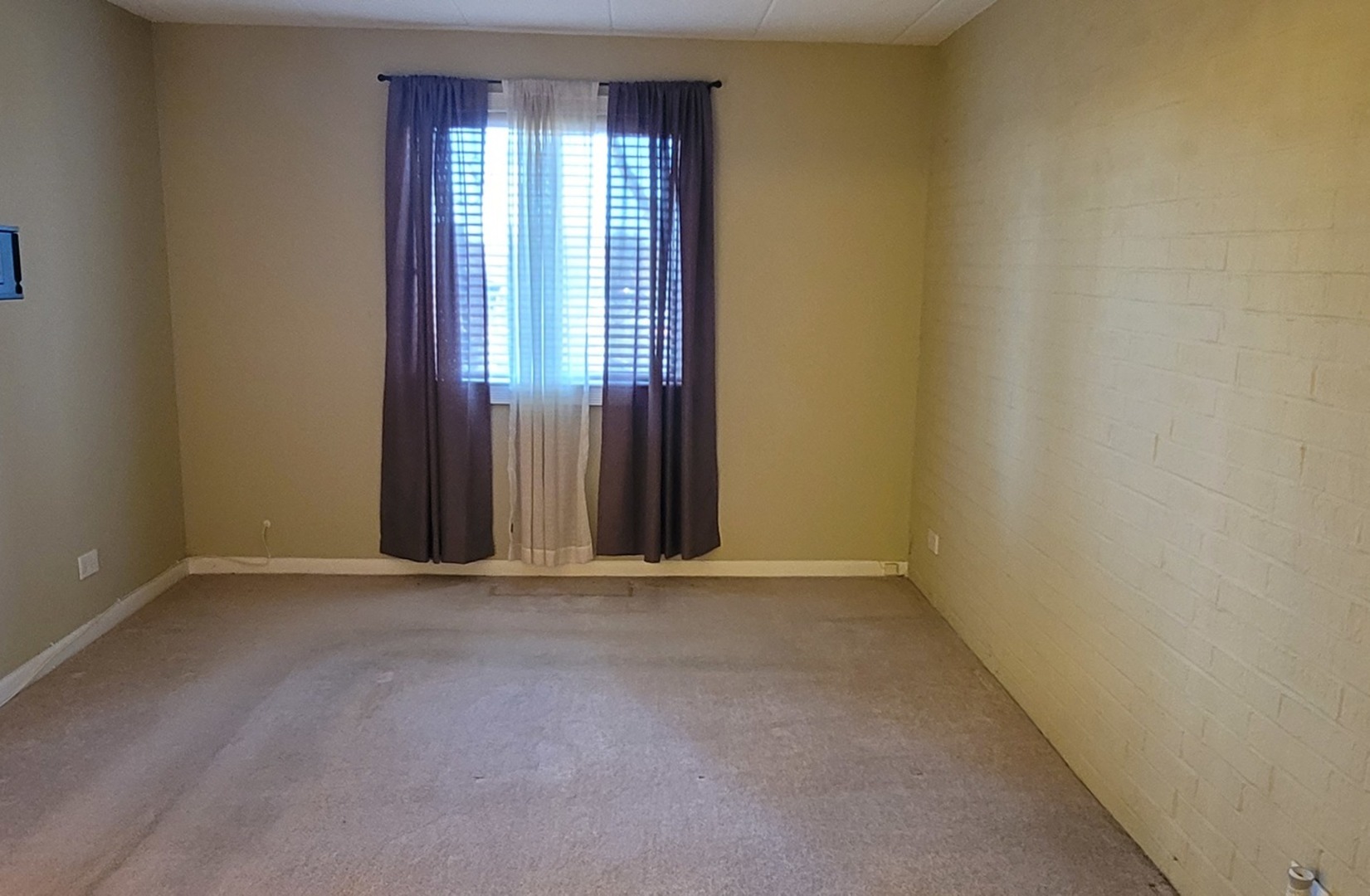 566 Timber Ridge Drive, Unit 203 Carol Stream, IL 60188 - Photo 7 of 17 an empty room with windows