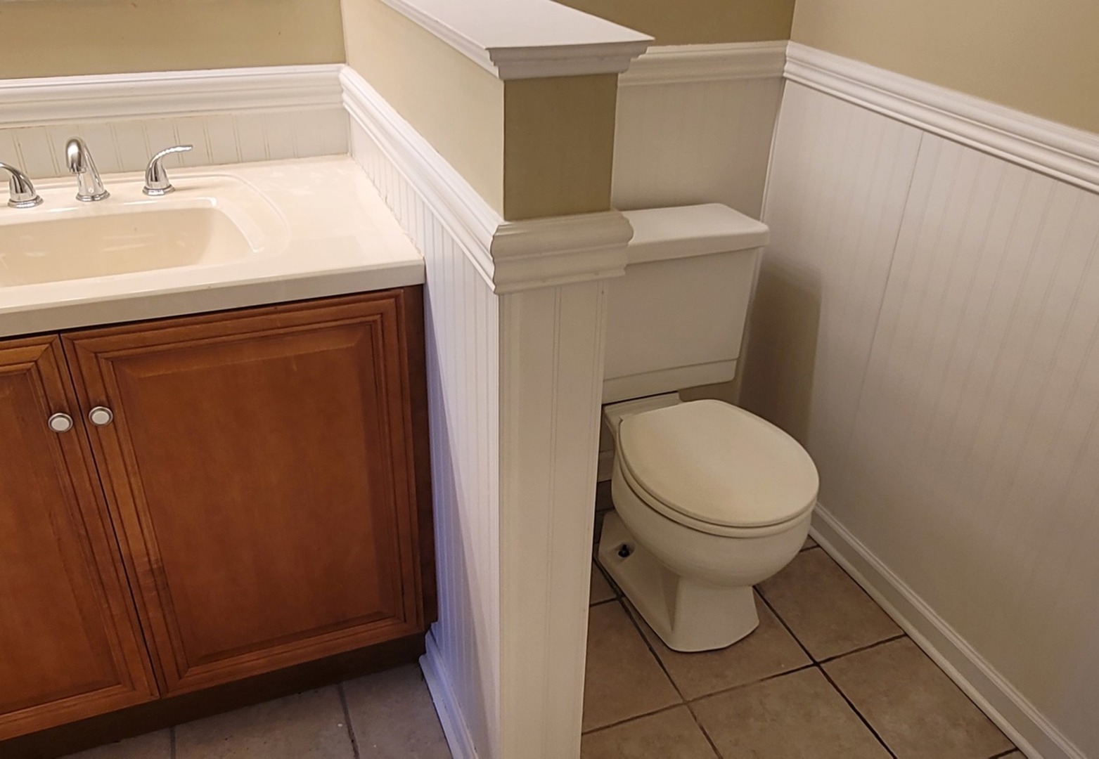 566 Timber Ridge Drive, Unit 203 Carol Stream, IL 60188 - Photo 9 of 17 a white toilet sitting next to a bathroom sink
