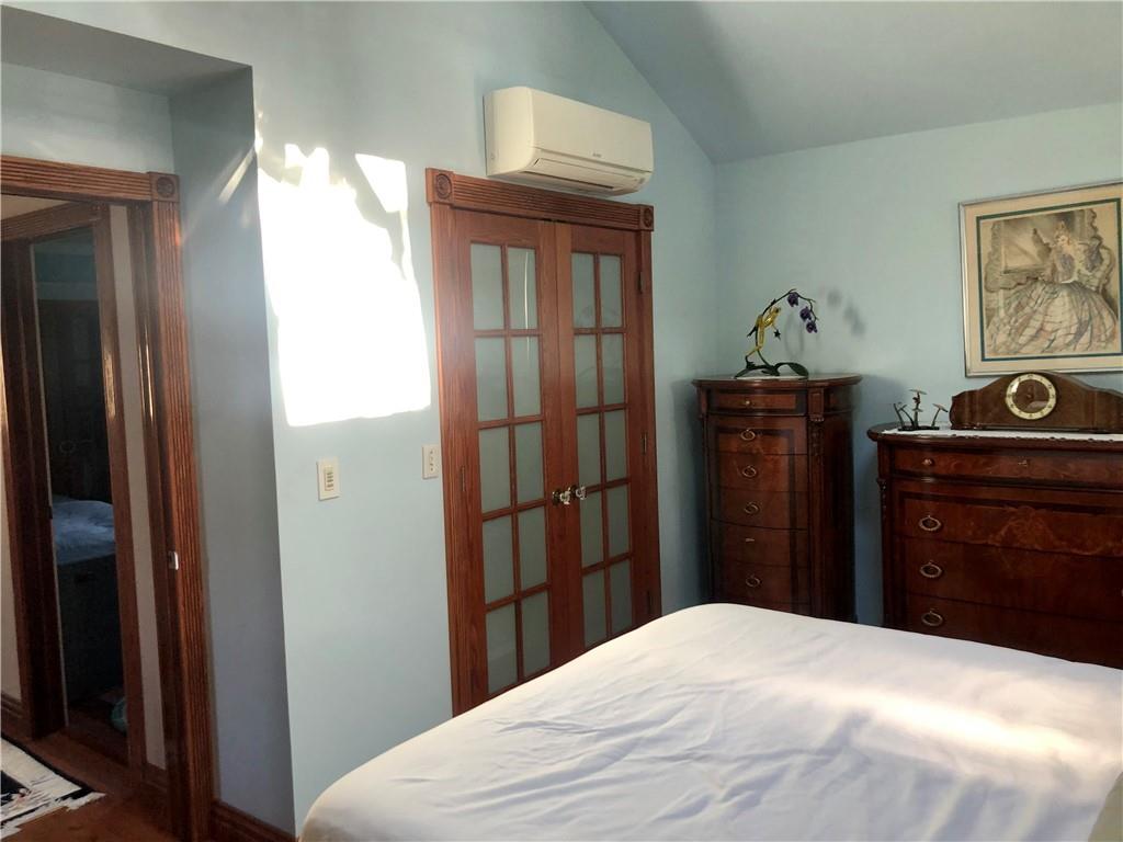 1933 Hendrickson Street Brooklyn, NY 11234 - Photo 12 of 17 a bedroom with a bed and a dresser