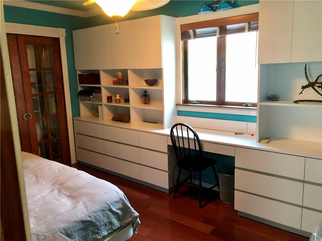 1933 Hendrickson Street Brooklyn, NY 11234 - Photo 13 of 17 a bedroom with a bed and a large window