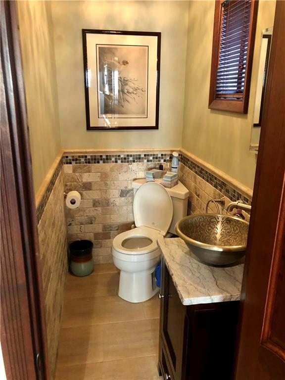 1933 Hendrickson Street Brooklyn, NY 11234 - Photo 10 of 17 a bathroom with a toilet and a sink