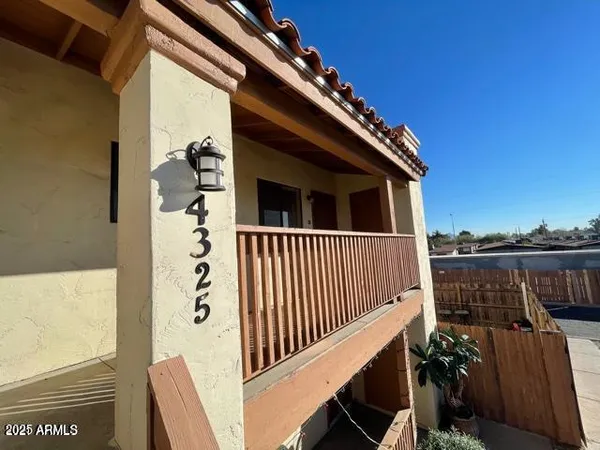 a view of a balcony with wooden floor