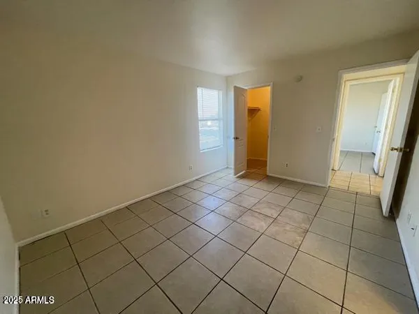 a view of an empty room and a window