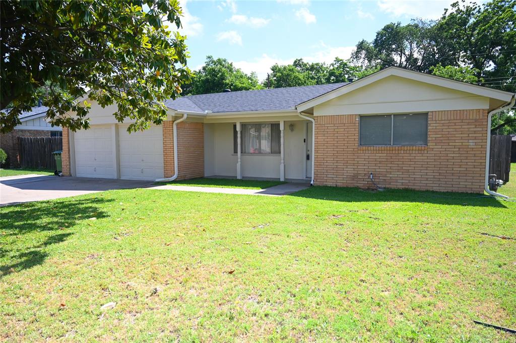 1352 Simpson Drive Hurst, TX 76053 - Photo 2 of 40 Single-story residence featuring brick and siding exterior, a two-car garage, and a covered front entry