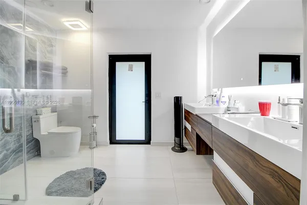 a kitchen with stainless steel appliances granite countertop a refrigerator sink and cabinets