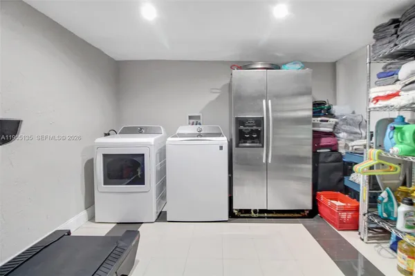 a view of a yard with plants and trees