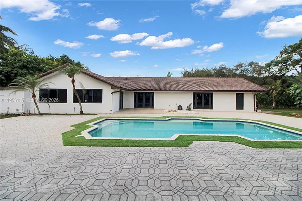 a kitchen with a stove and a microwave