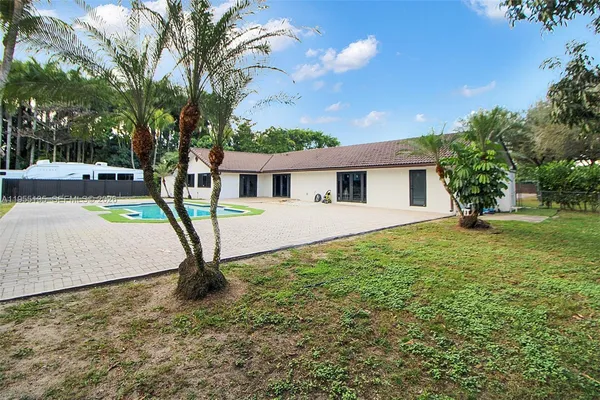 a bathroom with a toilet a sink and a mirror