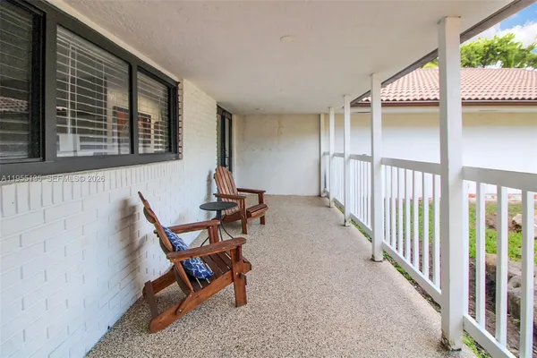 a bedroom with furniture and a wooden floor