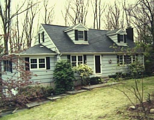 3 Marilyn Road Brookfield, CT 06804 - Photo 1 of 1 a front view of house with yard and trees in the background