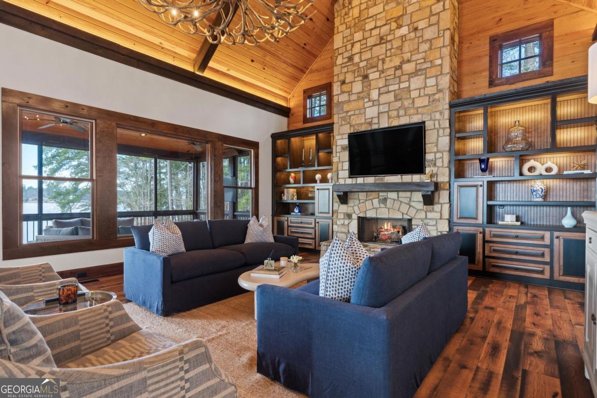 4096 Big Water E Road Sparta, GA 31087 - Photo 20 of 72 a living room with fireplace furniture and a flat screen tv