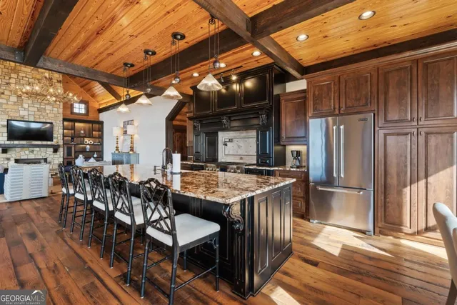 a kitchen with stainless steel appliances granite countertop a stove and cabinets