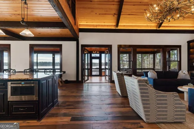 a kitchen with granite countertop a stove and cabinets