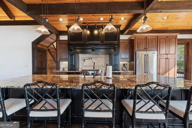 a bedroom with a bed and a view of a bathroom