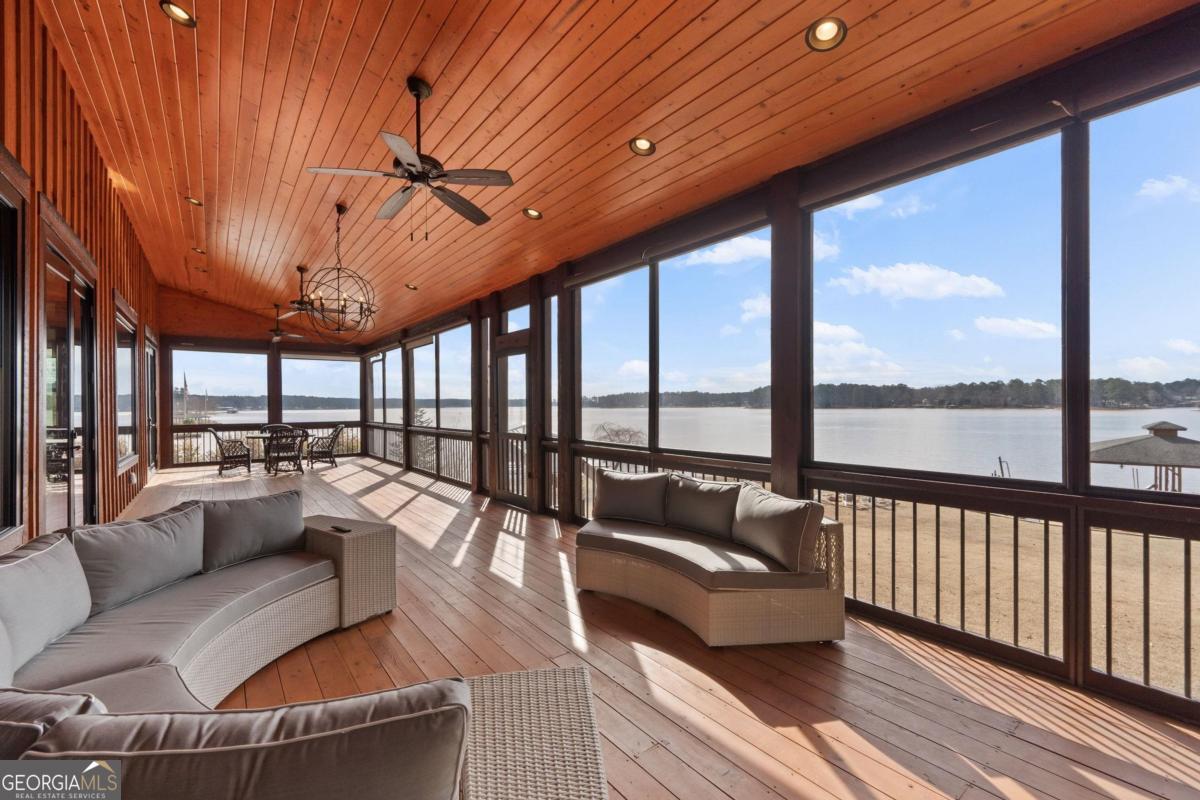 4096 Big Water E Road Sparta, GA 31087 - Photo 39 of 72 a living room with furniture and a large window
