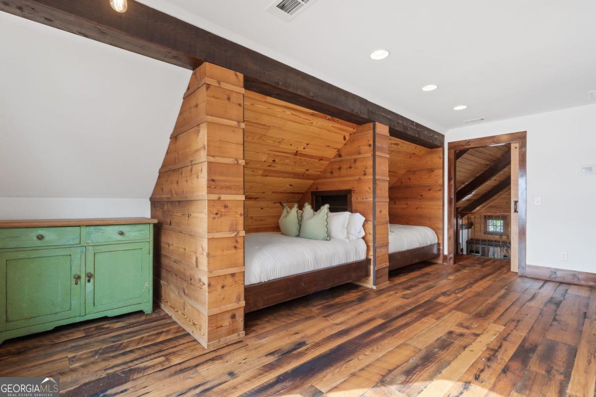 4096 Big Water E Road Sparta, GA 31087 - Photo 56 of 72 a bedroom with a bed and a dresser