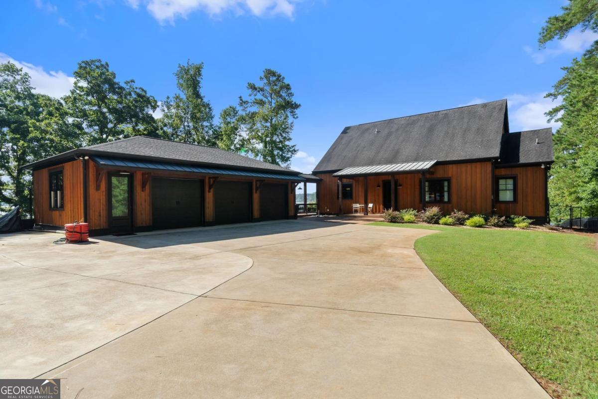 4096 Big Water E Road Sparta, GA 31087 - Photo 61 of 72 a front view of a house with a yard