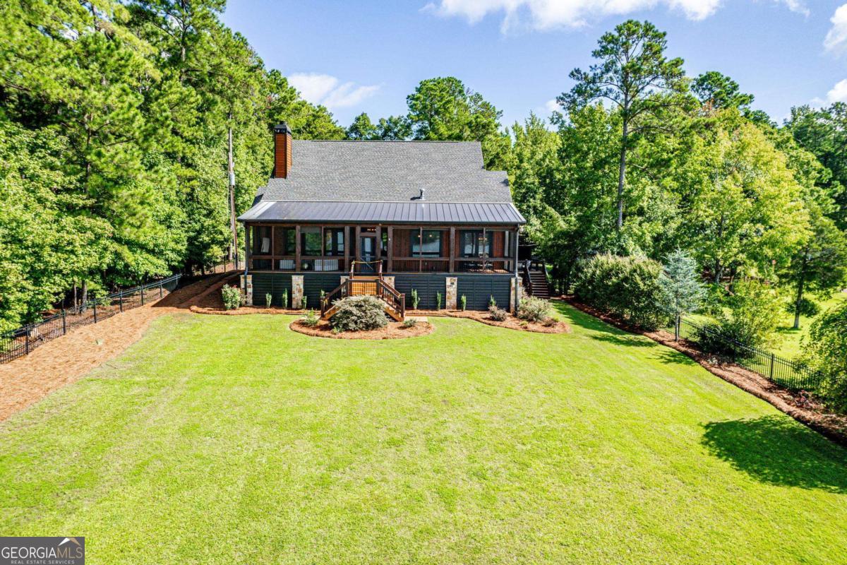 4096 Big Water E Road Sparta, GA 31087 - Photo 66 of 72 a view of a house with backyard and sitting area