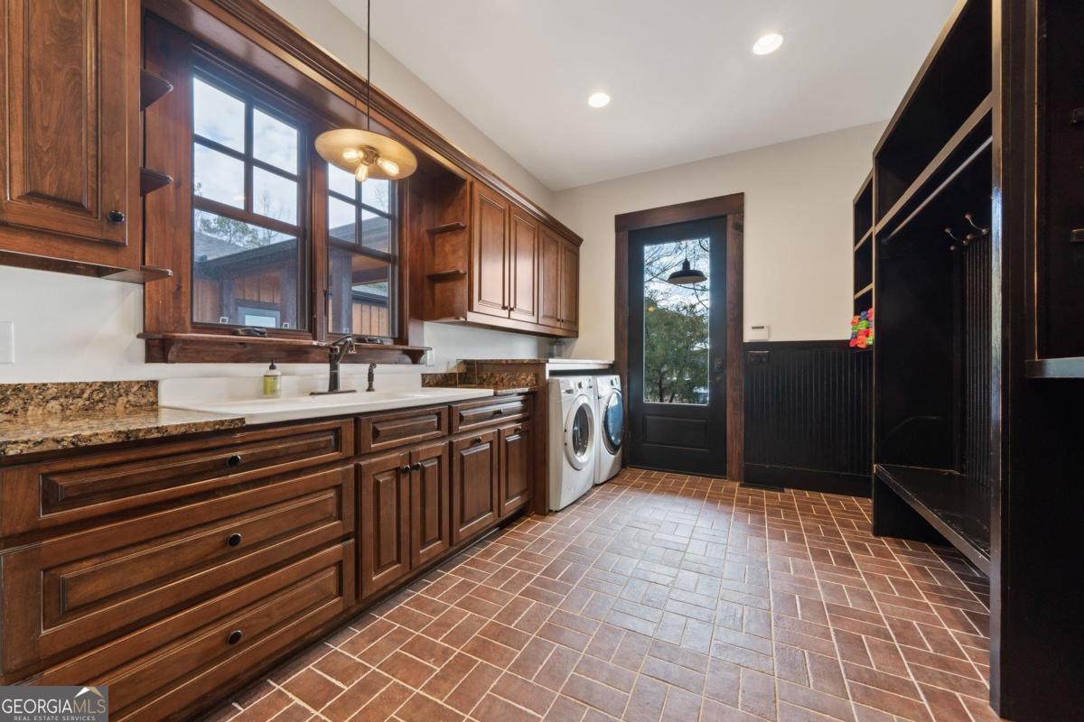 4096 Big Water E Road Sparta, GA 31087 - Photo 8 of 72 a large kitchen with stainless steel appliances granite countertop a refrigerator and a sink