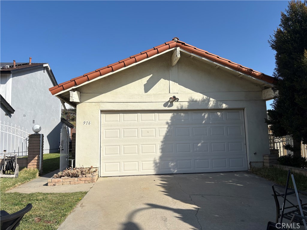 916 West Liberty Avenue Montebello, CA 90640 - Photo 1 of 1 a front view of a house with a garage