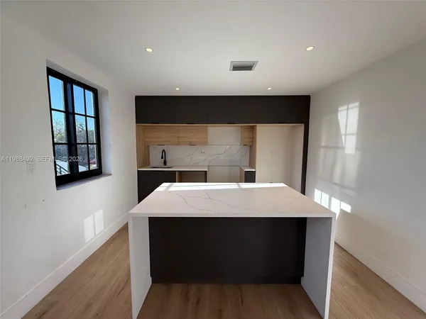 a room with a bed and a window