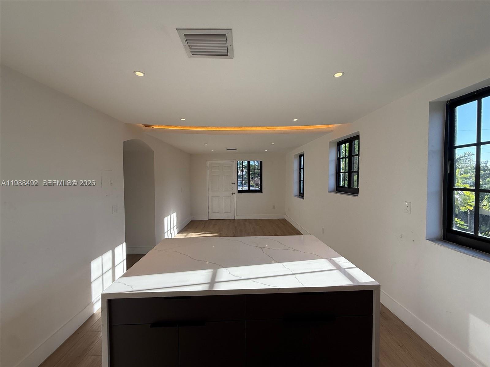 1716 Southwest 11th Street, Unit 4 Miami, FL 33135 - Photo 4 of 11 a view of a room with a table and chairs