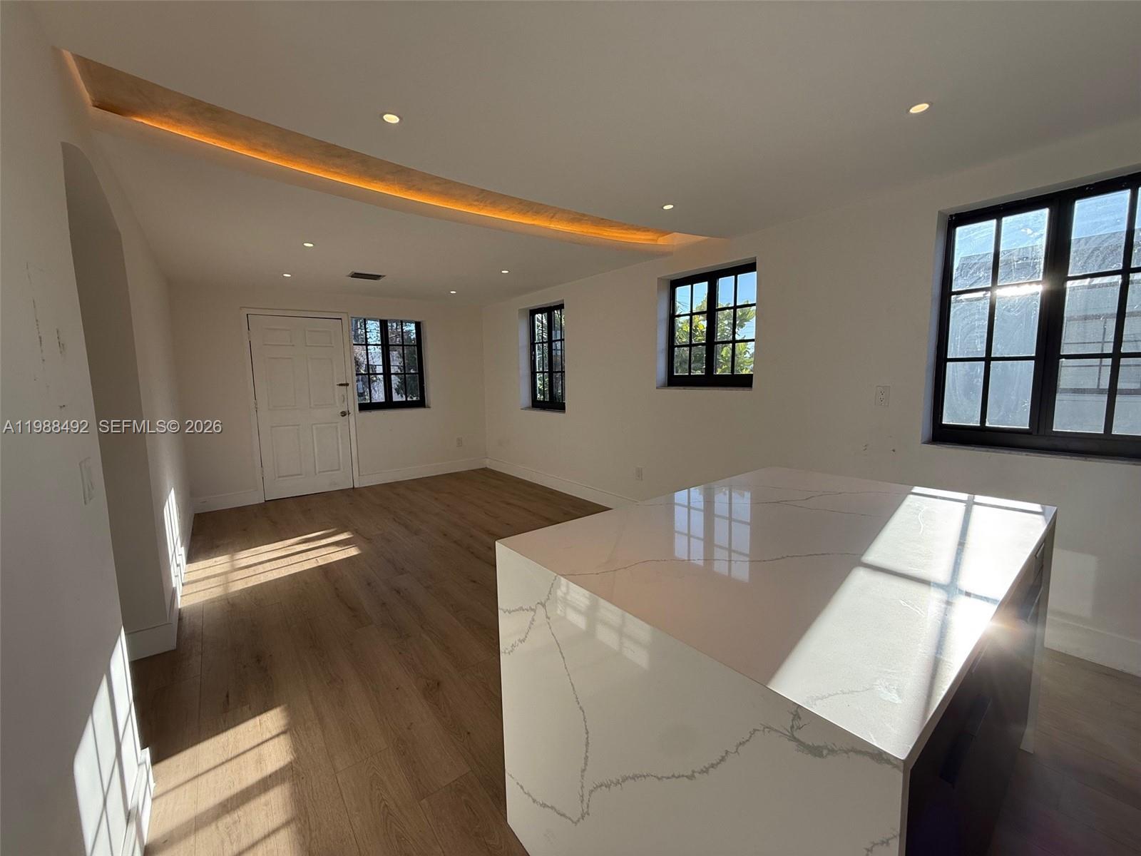 1716 Southwest 11th Street, Unit 4 Miami, FL 33135 - Photo 5 of 11 a view of livingroom and hardwood