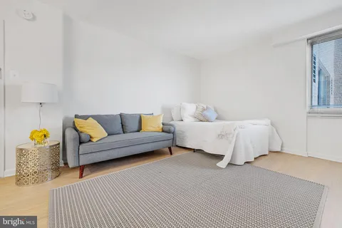 a bedroom with furniture and a couch