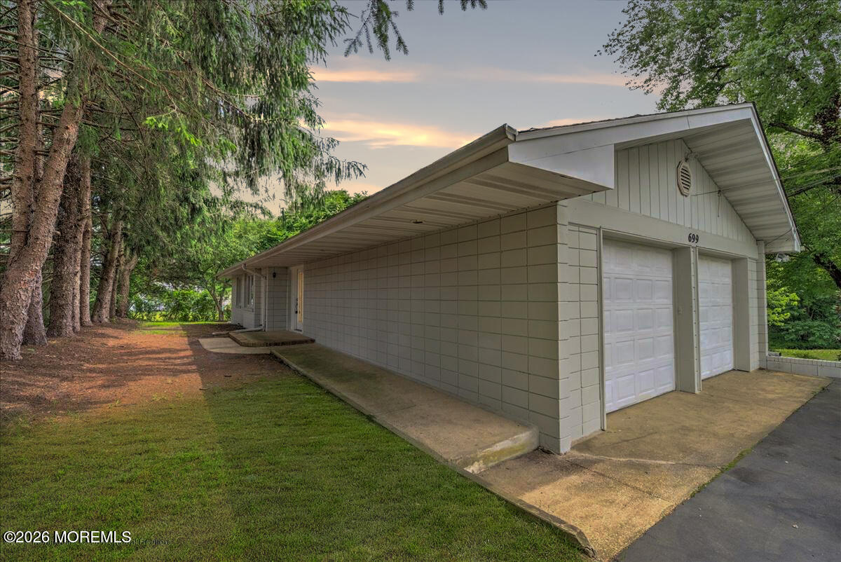 699 Aldrich Road Howell, NJ 07731 - Photo 1 of 23 a backyard of a house with lots of green space