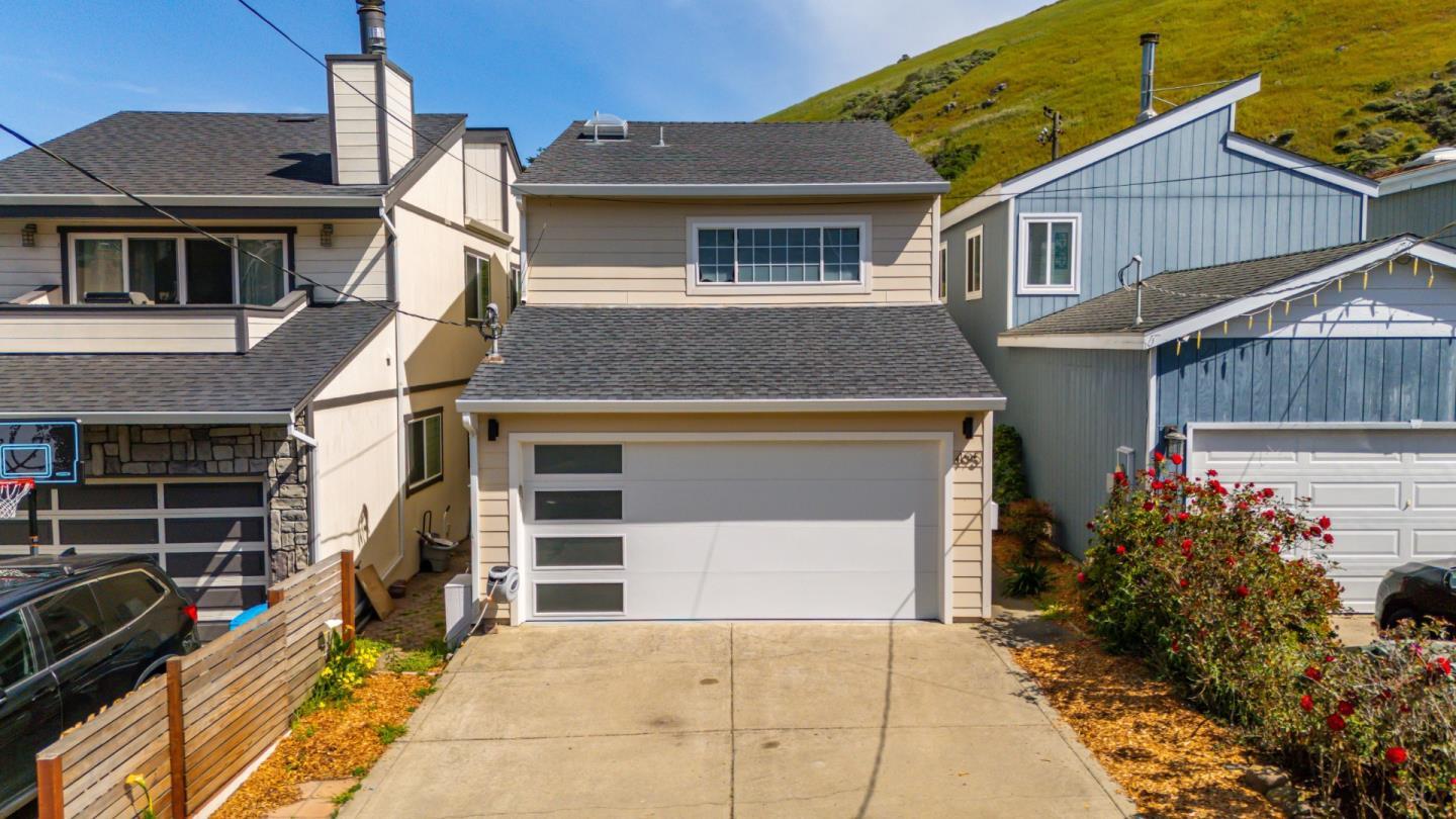 495 Ebken Street Pacifica, CA 94044 - Photo 1 of 52 a front view of a house with a garage