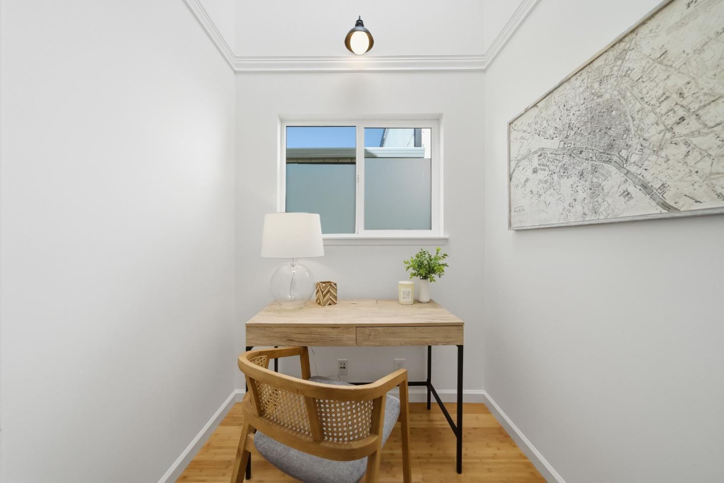 495 Ebken Street Pacifica, CA 94044 - Photo 27 of 52 a view of a workspace with furniture and wooden floor