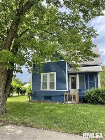 2228 9th Street Rock Island, IL 61201 - Photo 2 of 10 a front view of a house with a yard