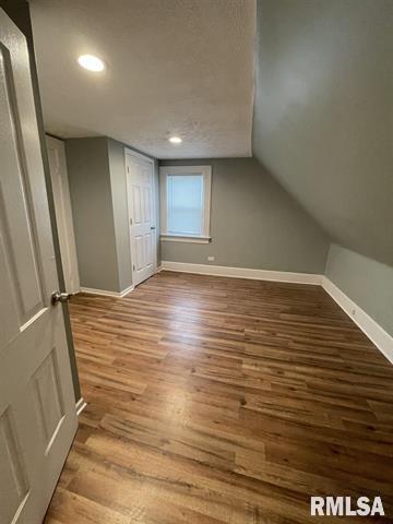 2228 9th Street Rock Island, IL 61201 - Photo 5 of 10 an empty room with wooden floor and windows