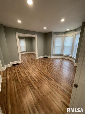 2228 9th Street Rock Island, IL 61201 - Photo 10 of 10 a view of an empty room with wooden floor