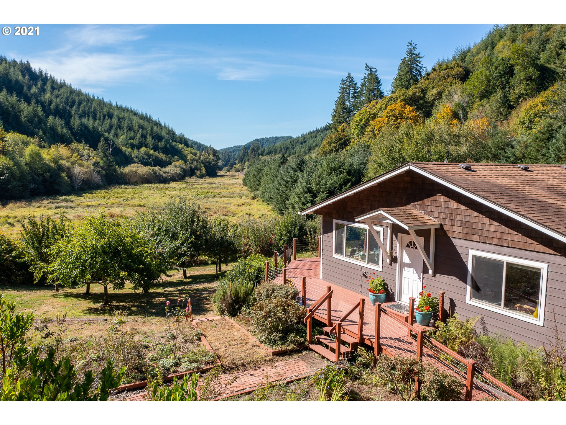 8715 Scholfield Road North Bend, OR 97459 - Photo 2 of 32 a view of a house with a yard