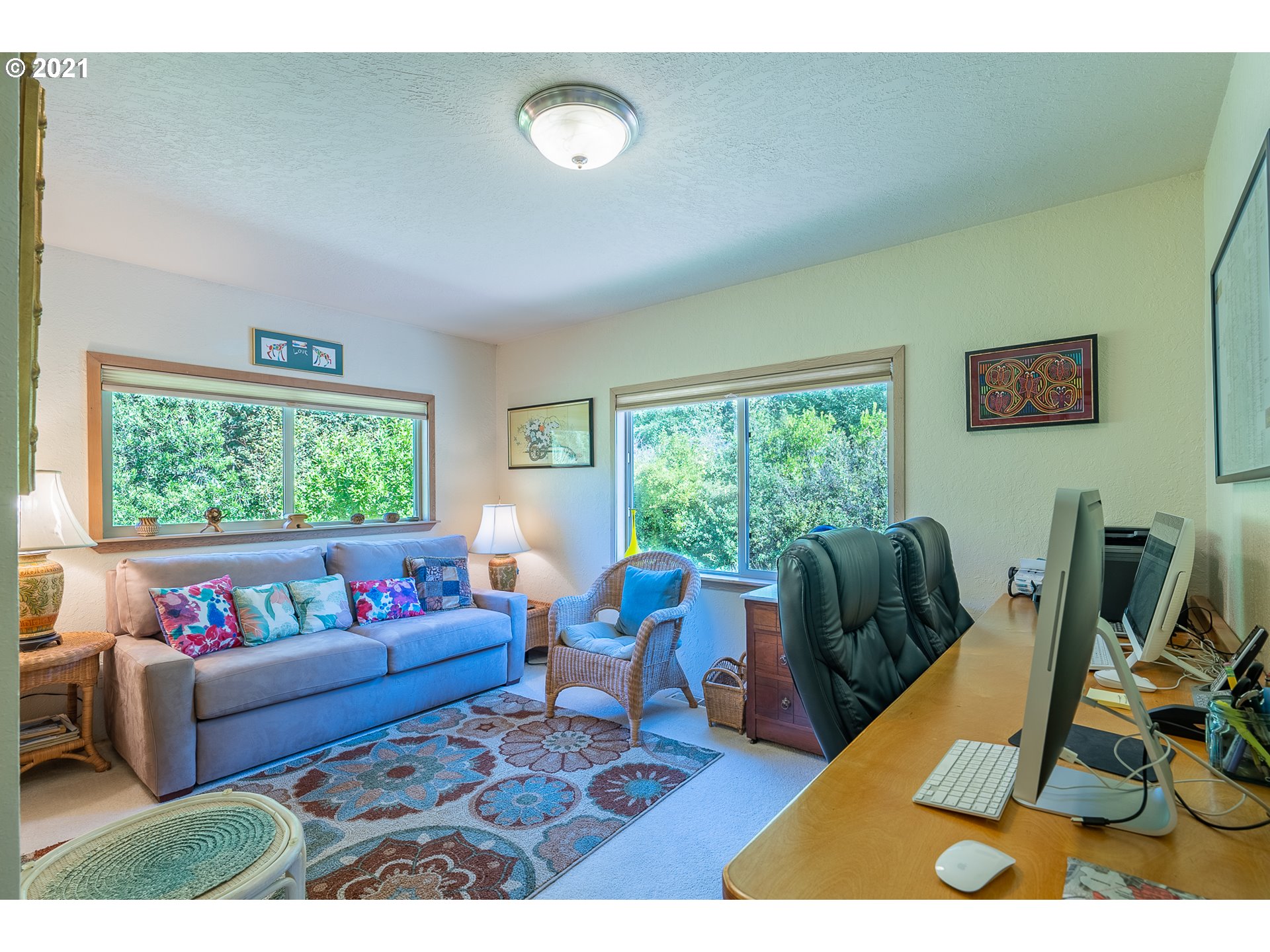 8715 Scholfield Road North Bend, OR 97459 - Photo 13 of 32 a living room with furniture rug and a large window