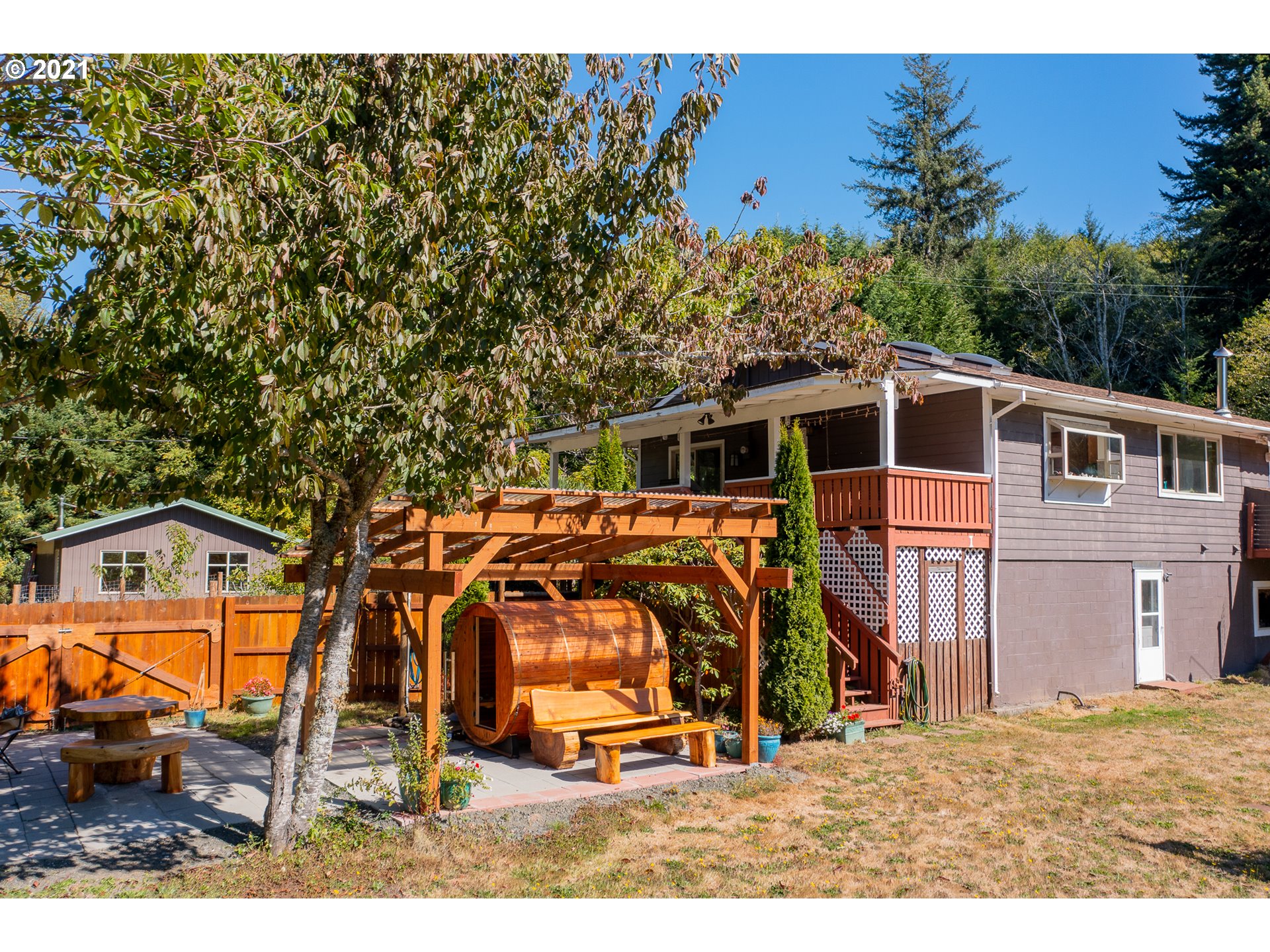 8715 Scholfield Road North Bend, OR 97459 - Photo 28 of 32 a view of front a house with a yard