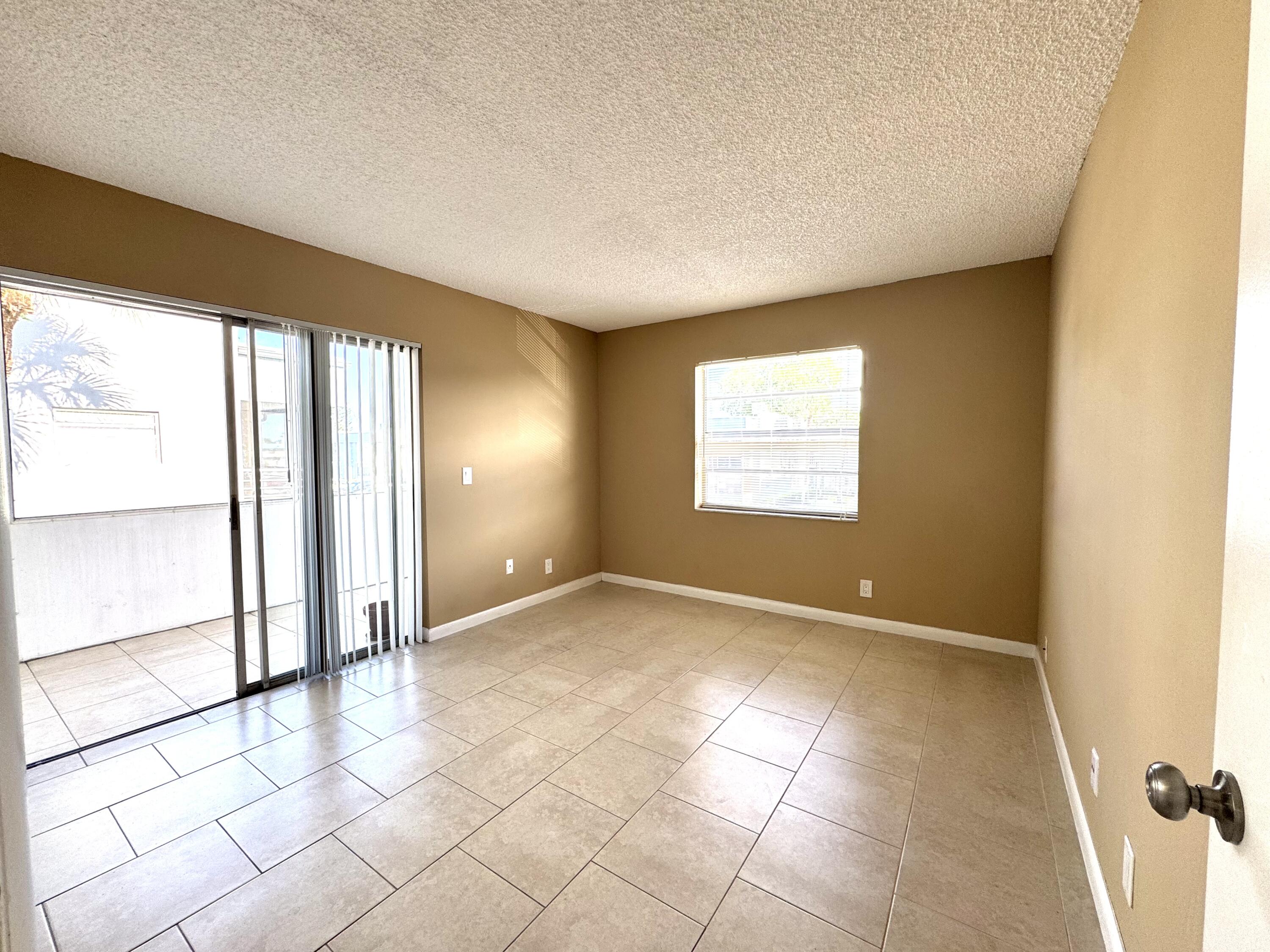 900 Normandy Lane Delray Beach, FL 33484 - Photo 14 of 22 a view of an empty room and window