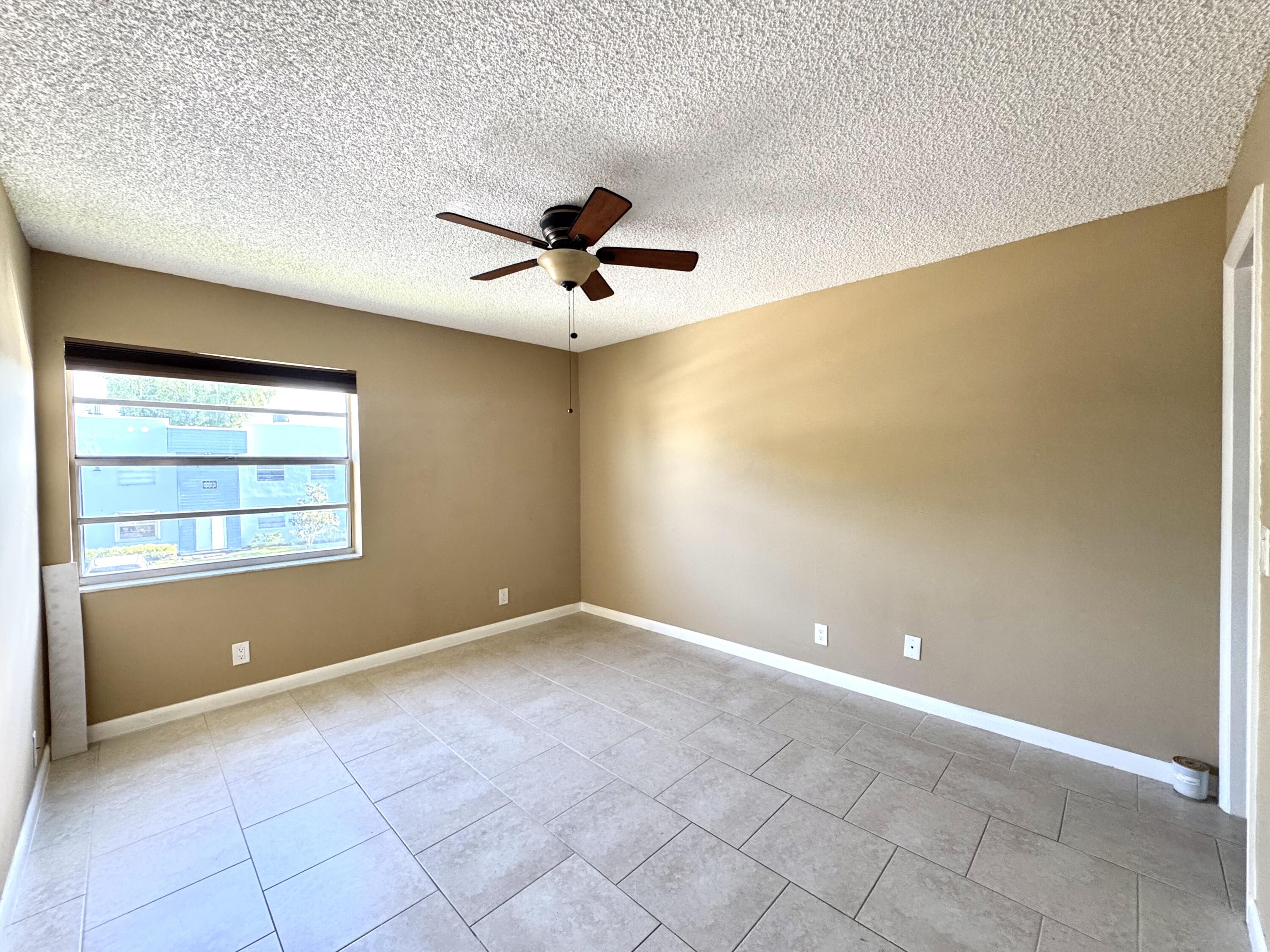 900 Normandy Lane Delray Beach, FL 33484 - Photo 18 of 22 a view of an empty room with a window
