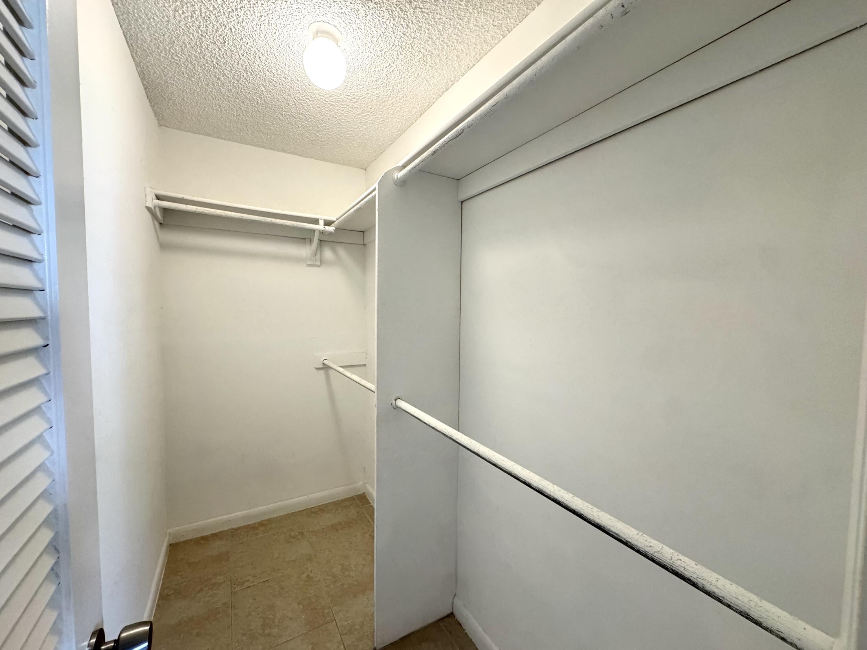 900 Normandy Lane Delray Beach, FL 33484 - Photo 21 of 22 a view of closet