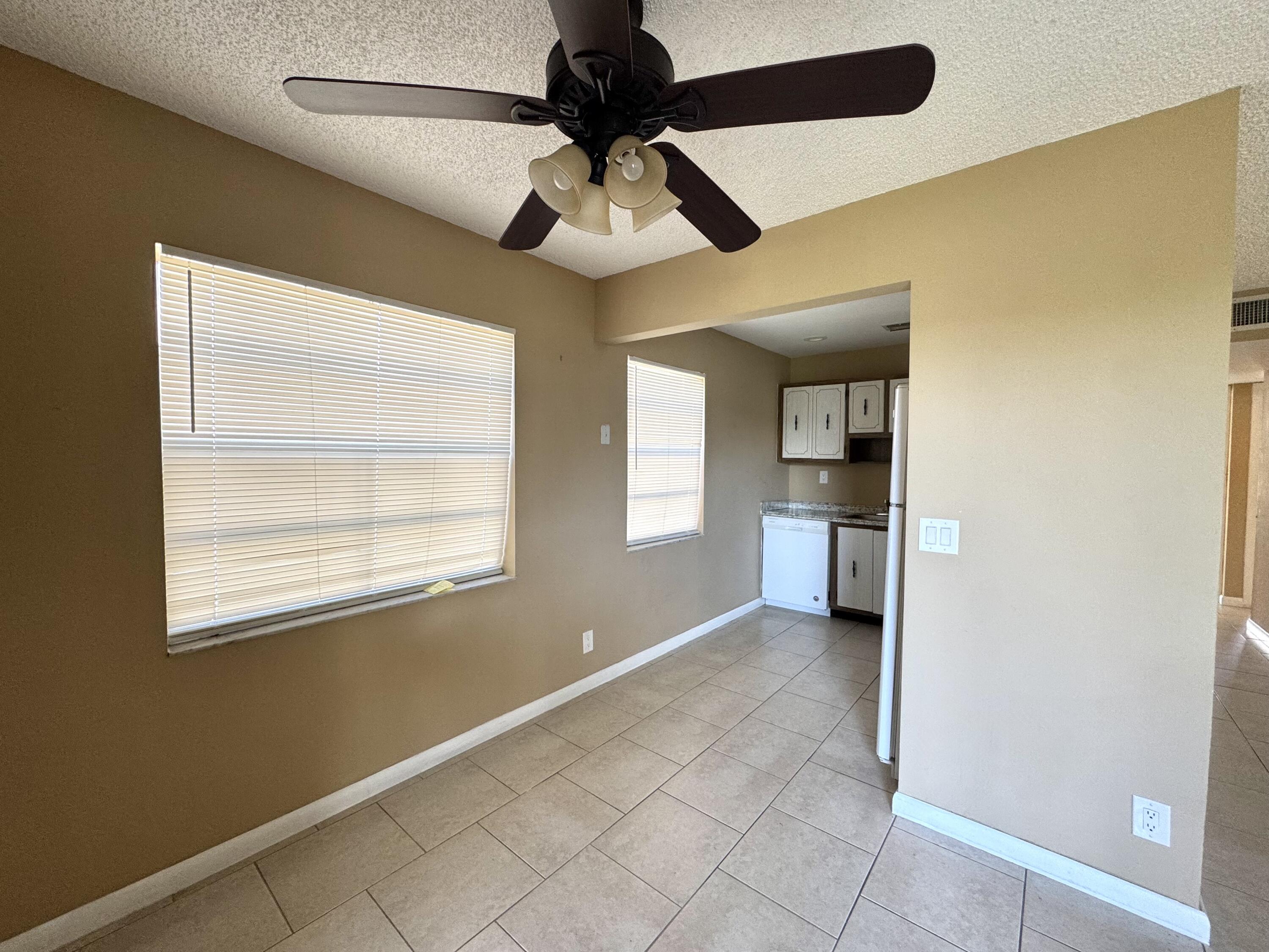 900 Normandy Lane Delray Beach, FL 33484 - Photo 4 of 22 a view of an empty room with a window