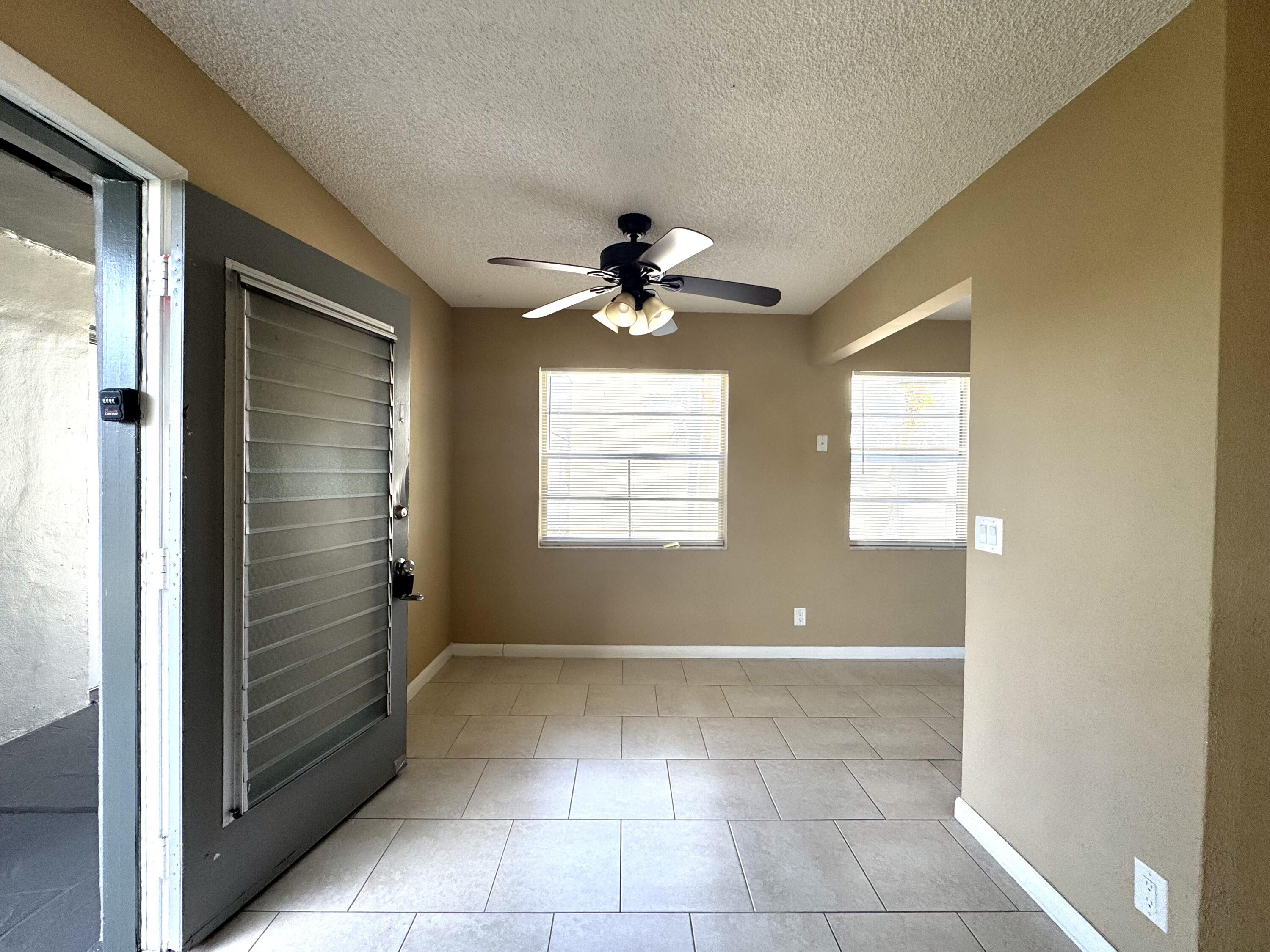 900 Normandy Lane Delray Beach, FL 33484 - Photo 5 of 22 a view of an empty room with a window
