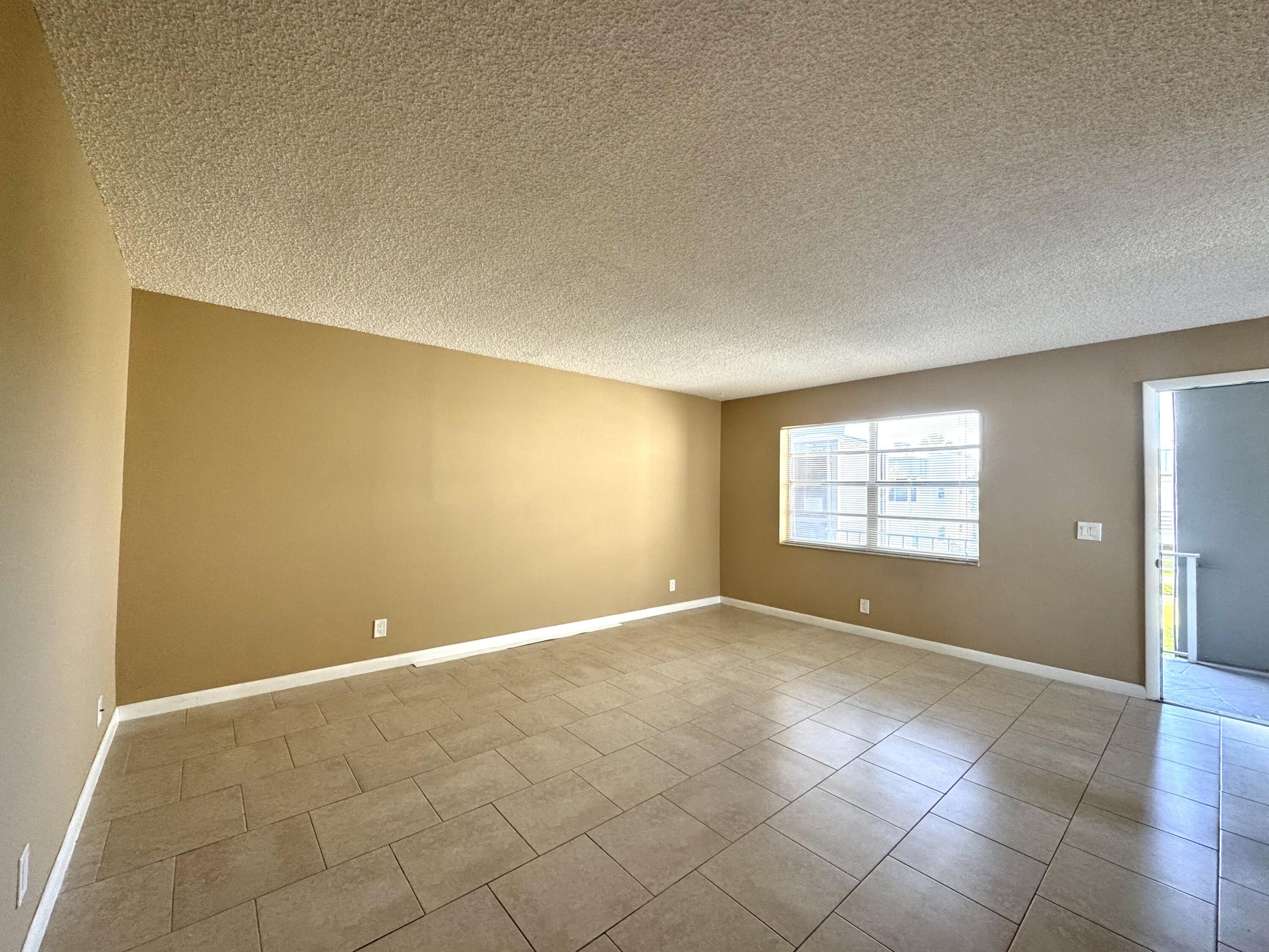 900 Normandy Lane Delray Beach, FL 33484 - Photo 9 of 22 an empty room with windows and closet