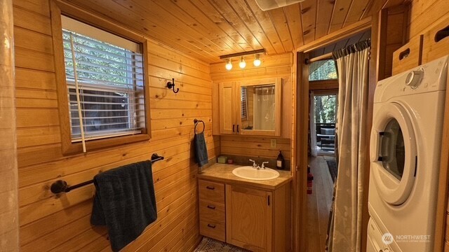 1546 Reservation Road Southeast, Unit 264 Olympia, WA 98513 - Photo 23 of 40 a bathroom with a sink a mirror and shower